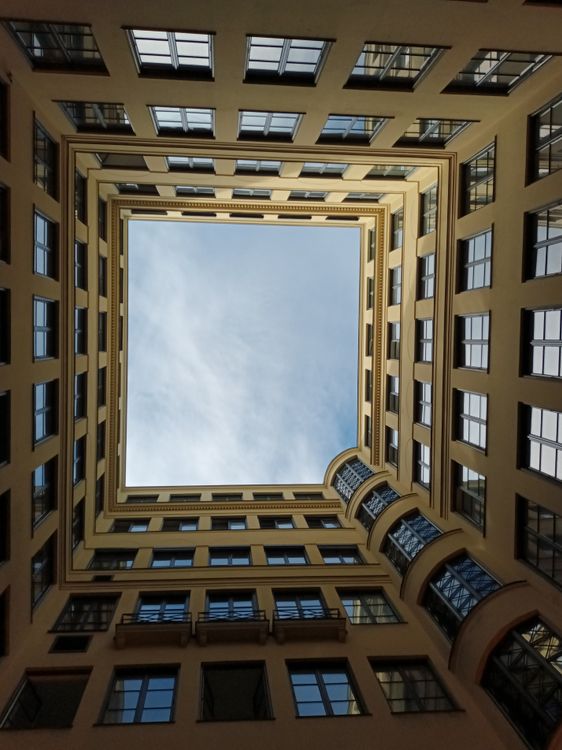 A view of a building from the ground looking up · Free Stock Photo