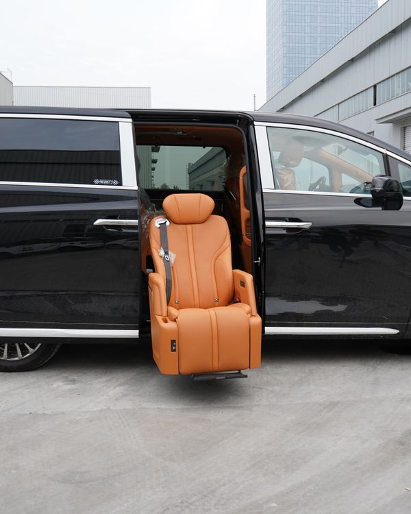 Black luxury minivan showcasing a unique swivel seat for easy access.