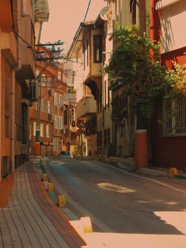Explore an atmospheric narrow street in a historic urban setting, showcasing traditional architecture and quiet charm.