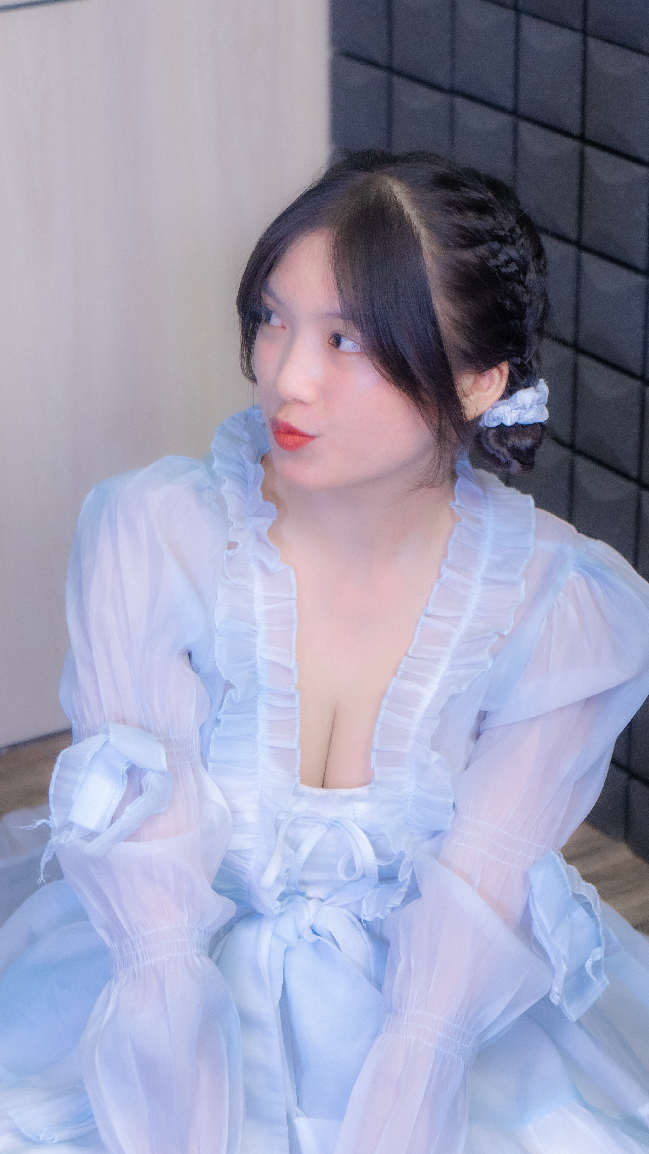 A woman in a blue dress sitting on a chair · Free Stock Photo