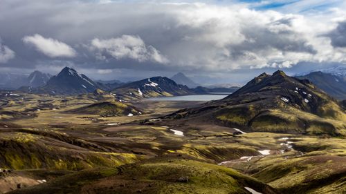 Free Breathtaking view of Landmannalaugar valley with mountains and lake under cloudy skies in Iceland. Stock Photo