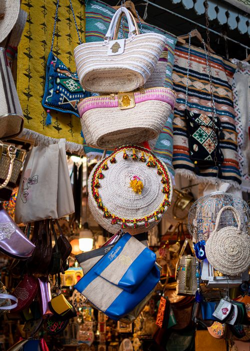 Free Colorful display of handmade bags and crafts in a Tunis souk market. Stock Photo
