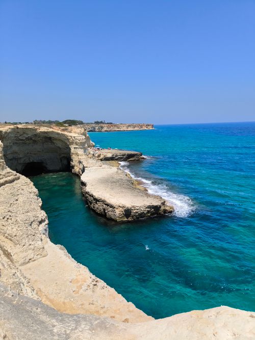 Free Stunning coastal cliffs with vibrant blue waters under a clear summer sky. Perfect travel destination. Stock Photo