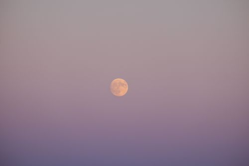 Free Serene full moon set against a pastel twilight sky, evoking tranquility and calm. Stock Photo