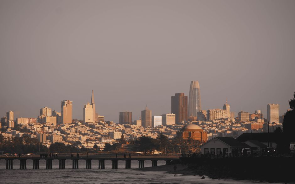 Stunning view of San Francisco's skyline at golden hour with prominent skyscrapers and a serene ambiance.