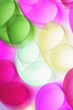 A vibrant abstract image featuring overlapping colorful shapes in pink, green, and yellow hues.