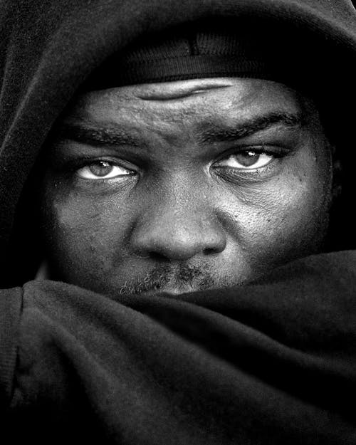 Grayscale Photography of Man Wearing Hoodie