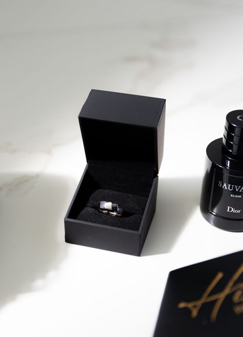 Free Luxurious black jewelry box with a shimmering diamond ring inside, styled elegantly. Stock Photo