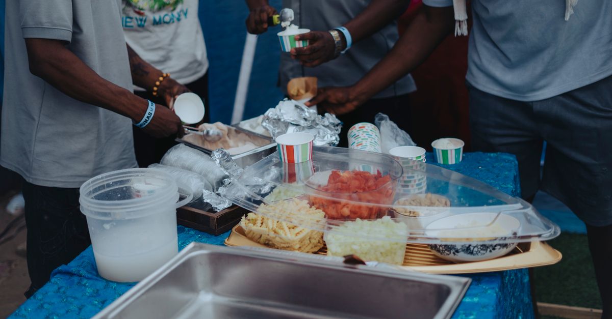 people serving and smiling at Christ Embassy Ho Loveworld Arena