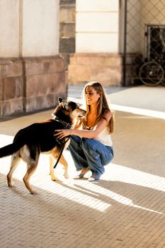 A woman and her dog in a lively, sunlit Copenhagen street scene symbolizing friendship and joy.