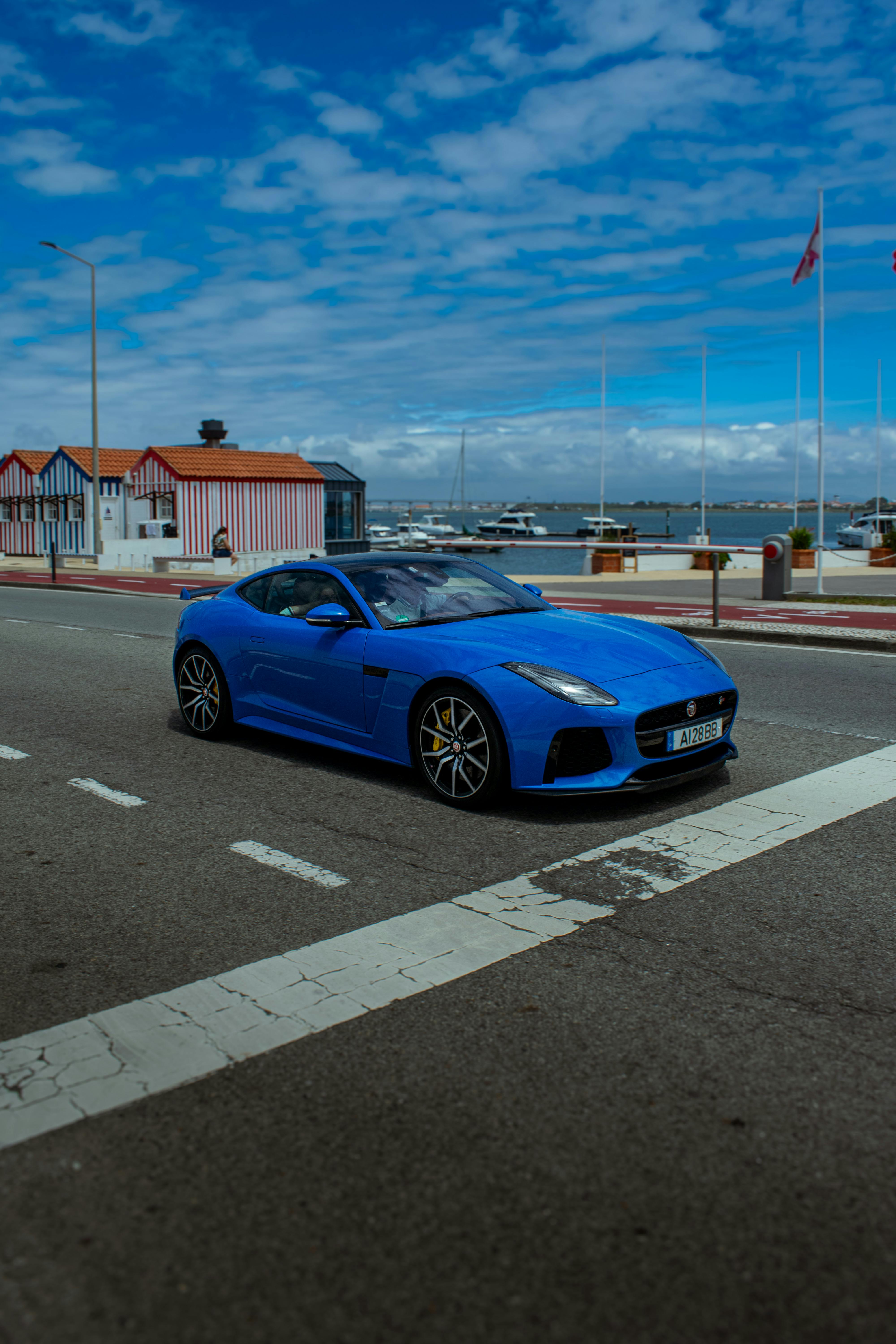 blue jaguar f type on street