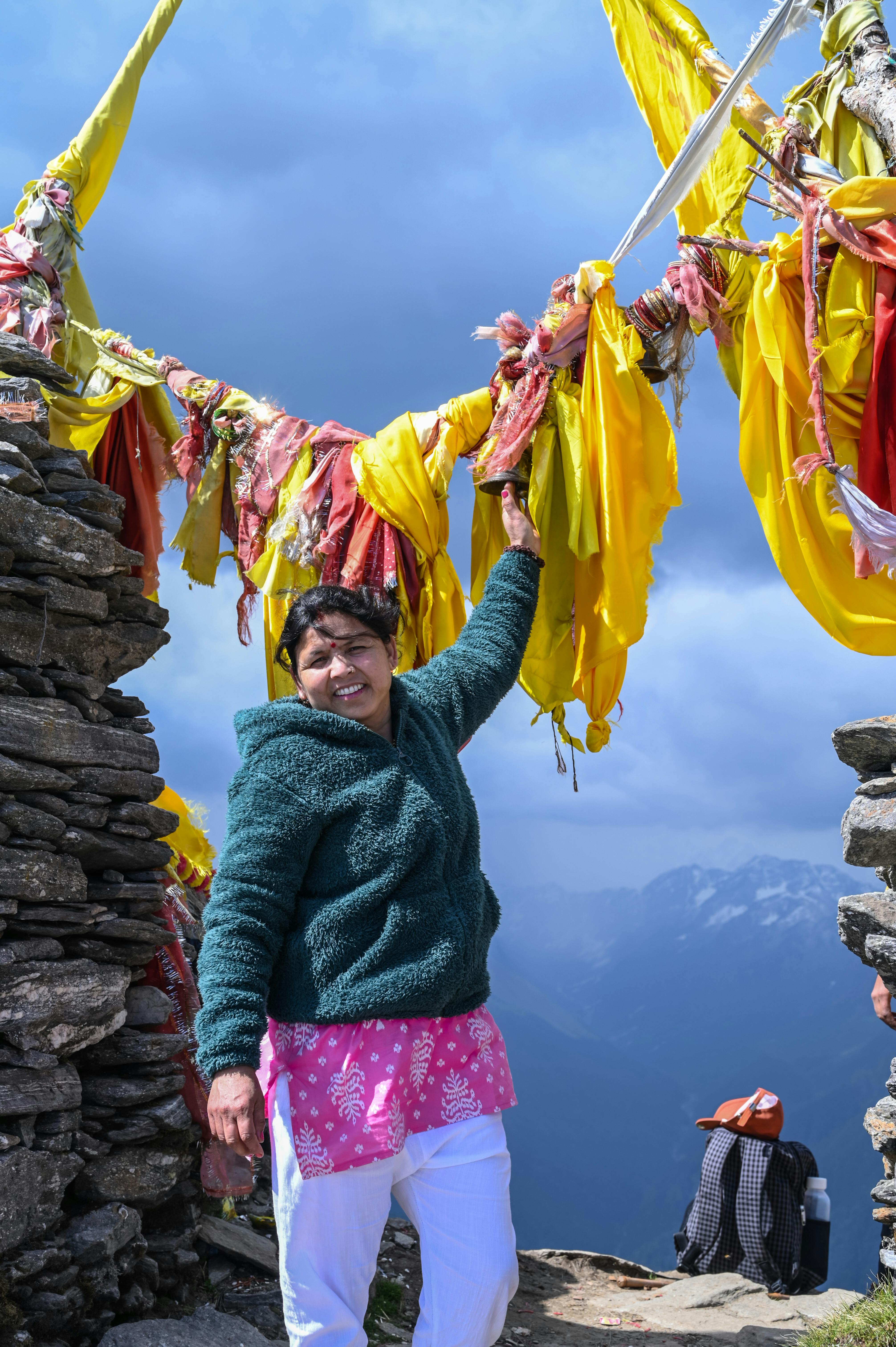 Colorful celebration at a temple in Gopeshwar, showcasing local culture and traditions in a mountain backdrop.