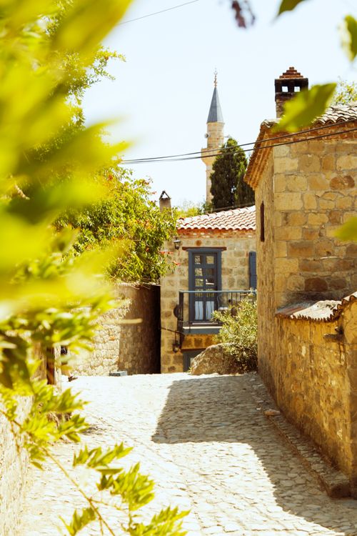 Free Discover the rustic beauty of Adatepe village with its stone buildings and serene atmosphere. Stock Photo