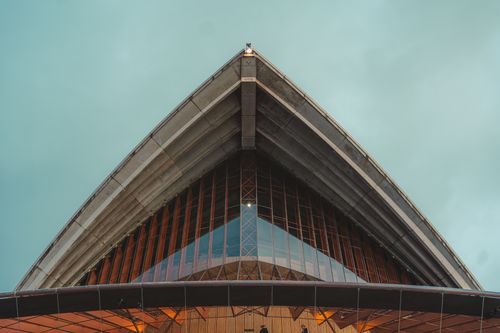 Free Modern architectural marvel showcasing futuristic design with a geometric facade against a clear sky. Stock Photo