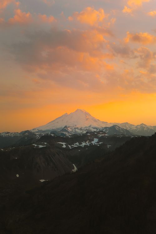 Free Stunning view of Mount Baker during sunset with orange skies and snow capped peaks. Stock Photo