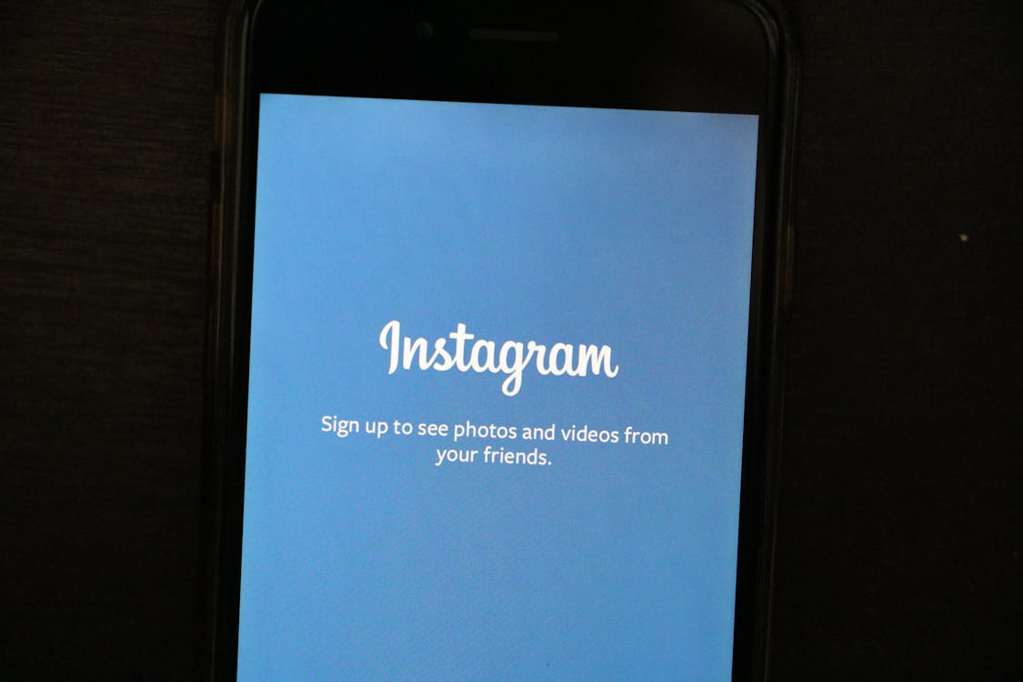 Free Turned-on Phone Displaying Instagram Application Stock Photo