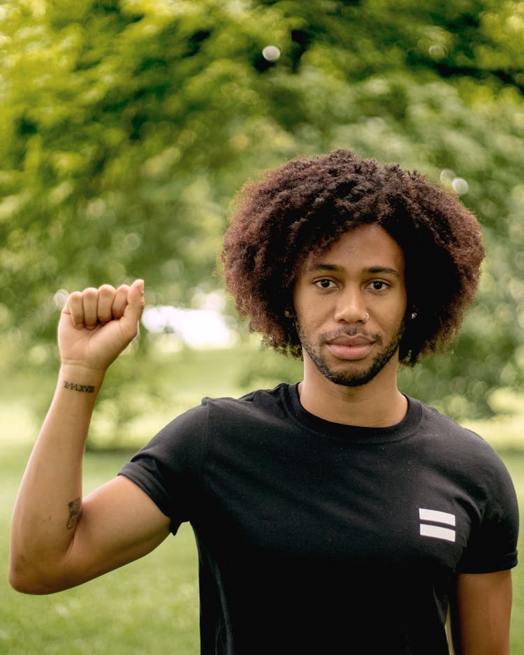 Photo Of Man Wearing Black Crew-neck T-shirt