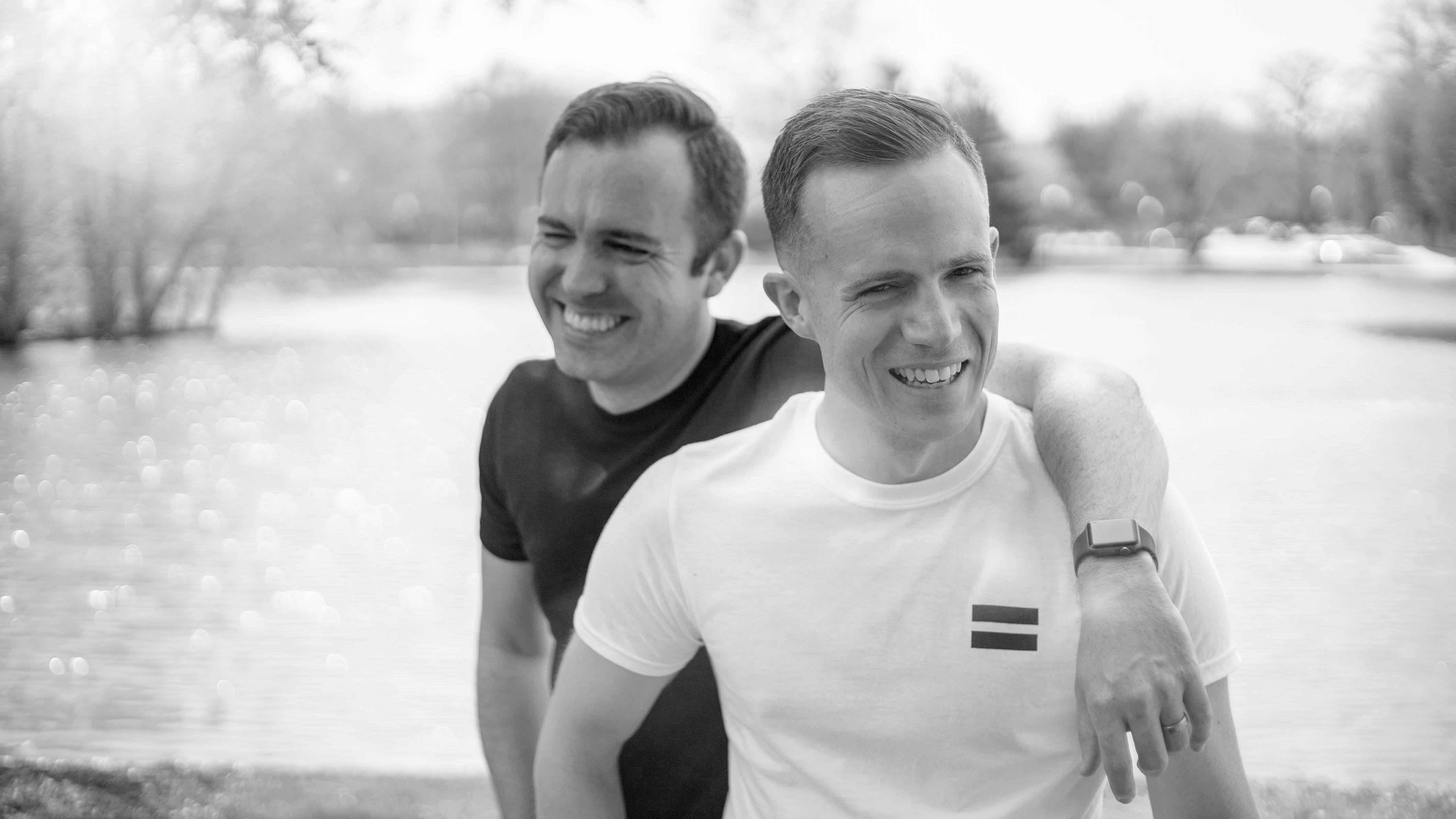 Men Wearing Black Shirt Beside White With White Shirt