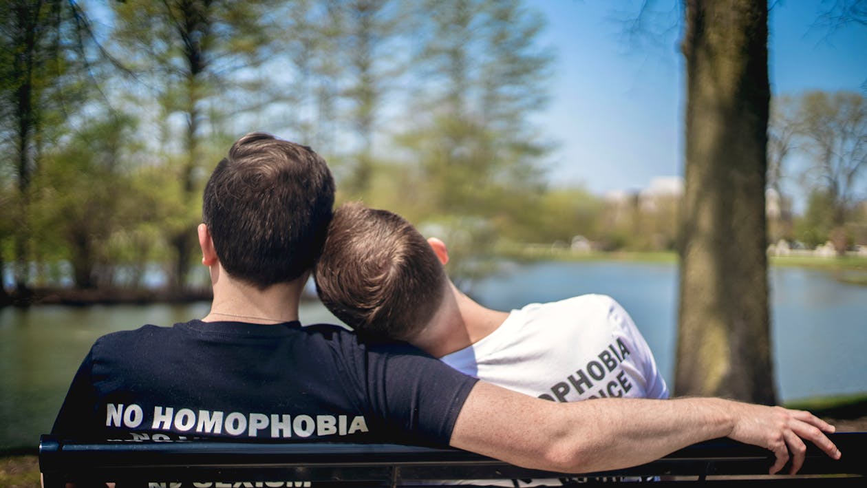 Free Man Leaning on Other Man Shoulders Stock Photo