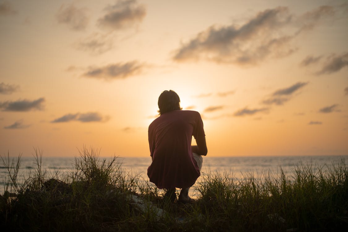 Man Sitting Near the Sea