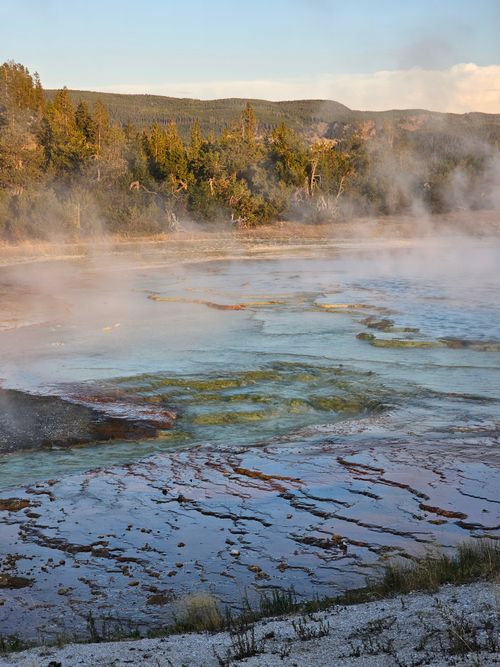 Free Capture of a steaming geyser field in a geothermal landscape within the United States, showcasing nature's raw power. Stock Photo