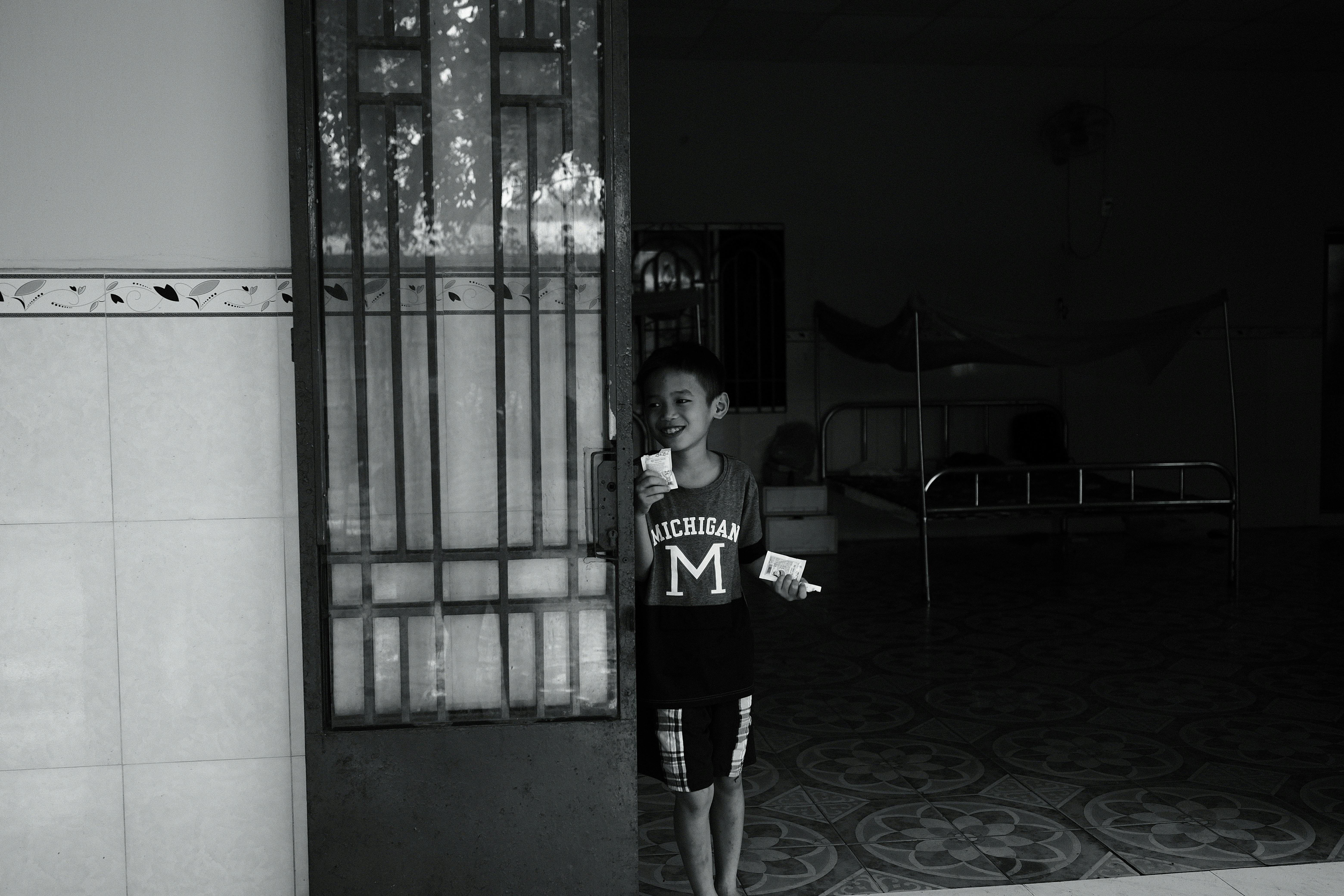 a boy standing in front of a door