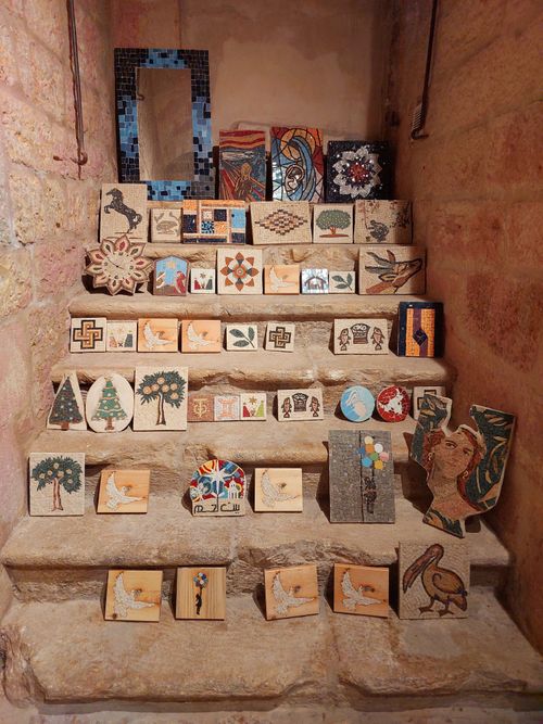 Free Colorful mosaic tiles displayed on ancient stone steps in Bethlehem, showcasing intricate artwork. Stock Photo