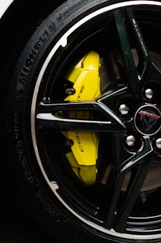 Detailed shot of a Chevrolet Corvette wheel rim with a bright yellow brake caliper.
