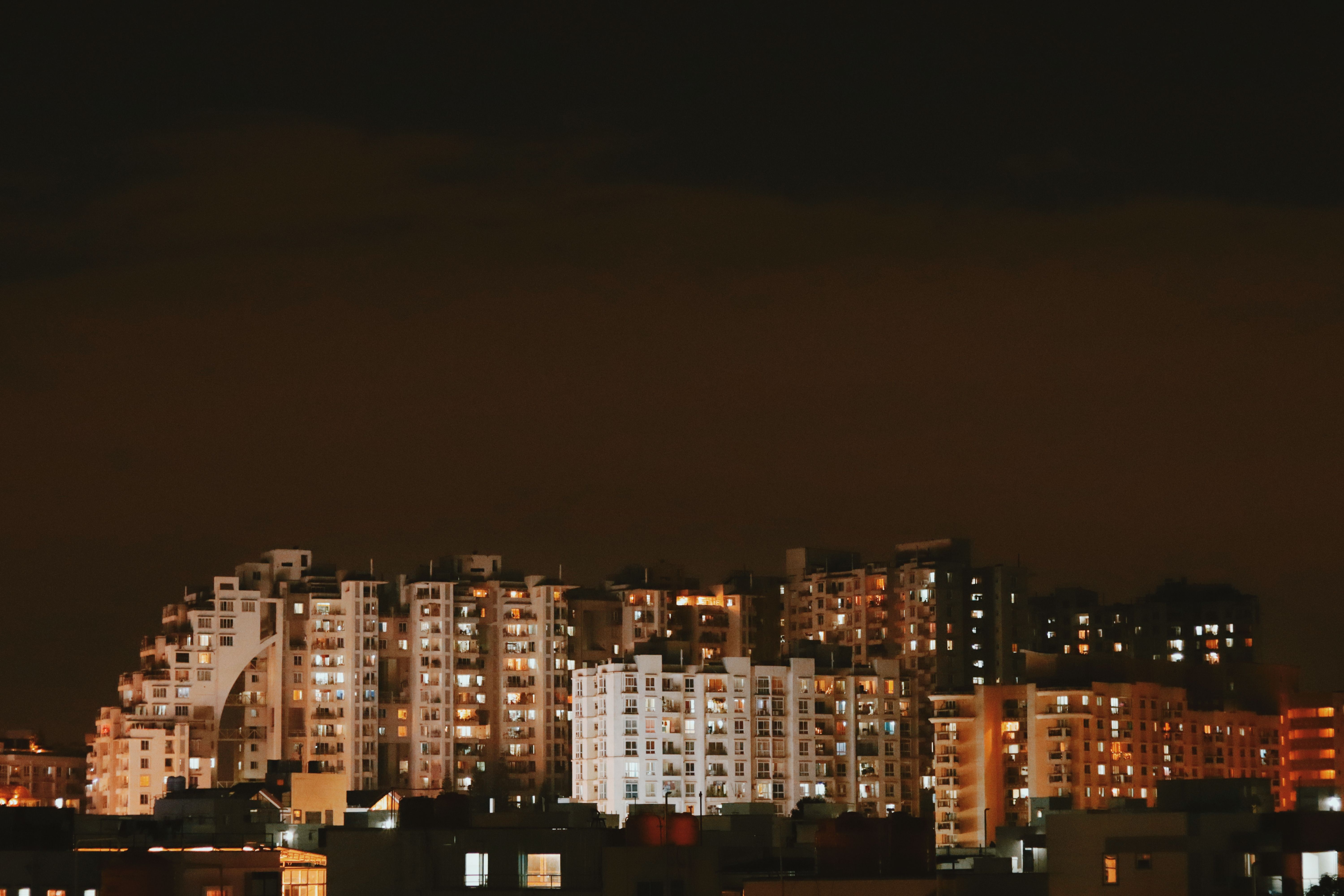 A city at night with buildings lit up · Free Stock Photo