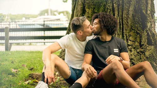 Free Man Kissing Other Man Stock Photo