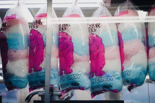 Free Vibrant cotton candy bags lined up in a shop, highlighting playful designs and colors. Stock Photo