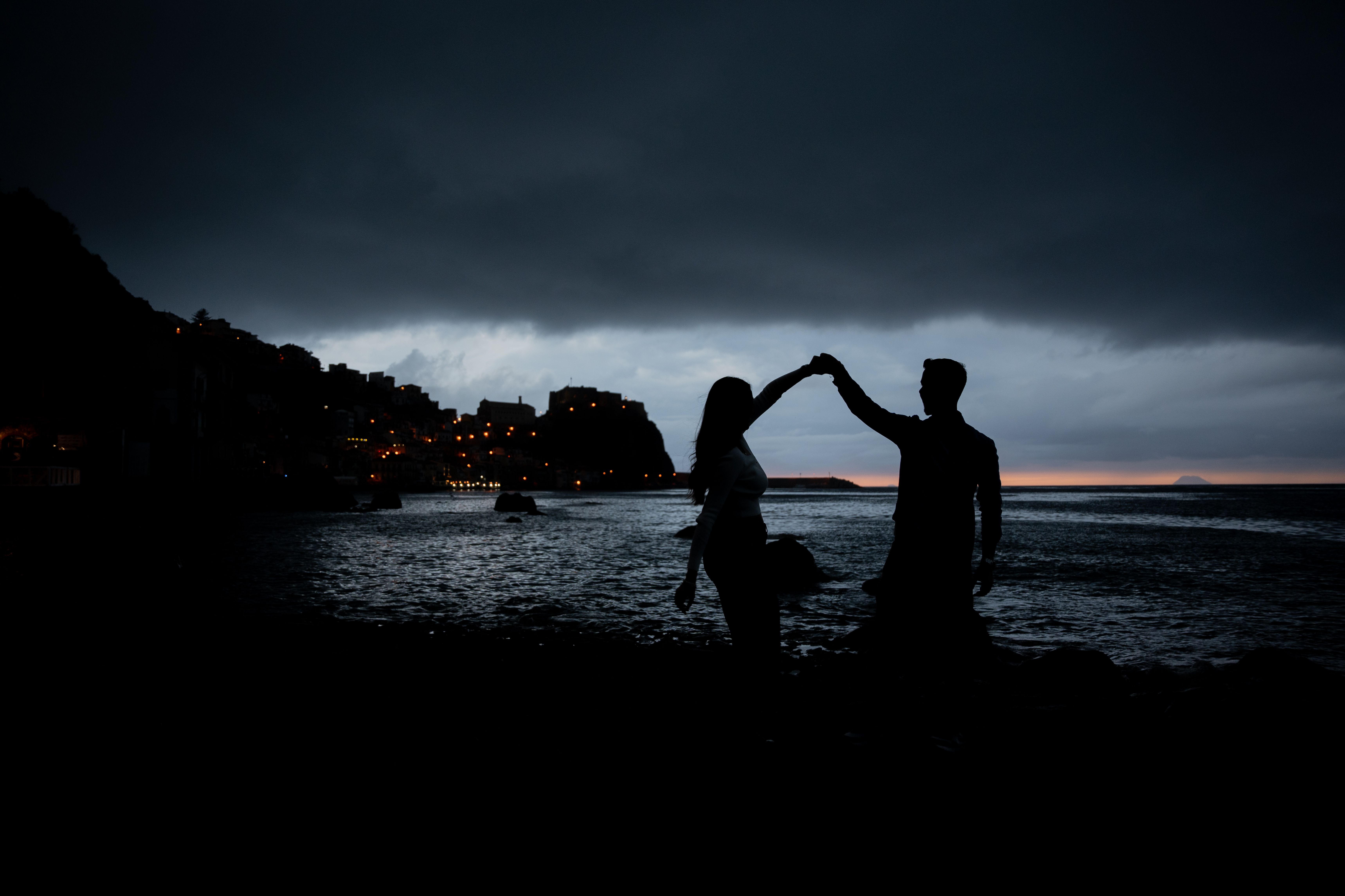 Silhouette of Couple Dancing at Dusk on Beach · Free Stock Photo