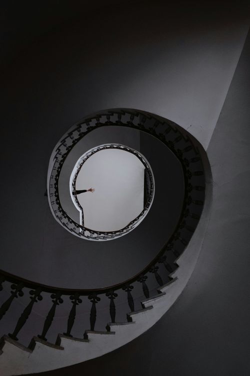 Free Captivating view of a spiral staircase creating a mesmerizing artistic design. Stock Photo
