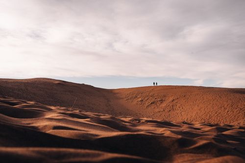 Free A beautiful landscape of sand dunes under a sunset sky in Mendoza, Argentina, capturing the expansive desert scene. Stock Photo
