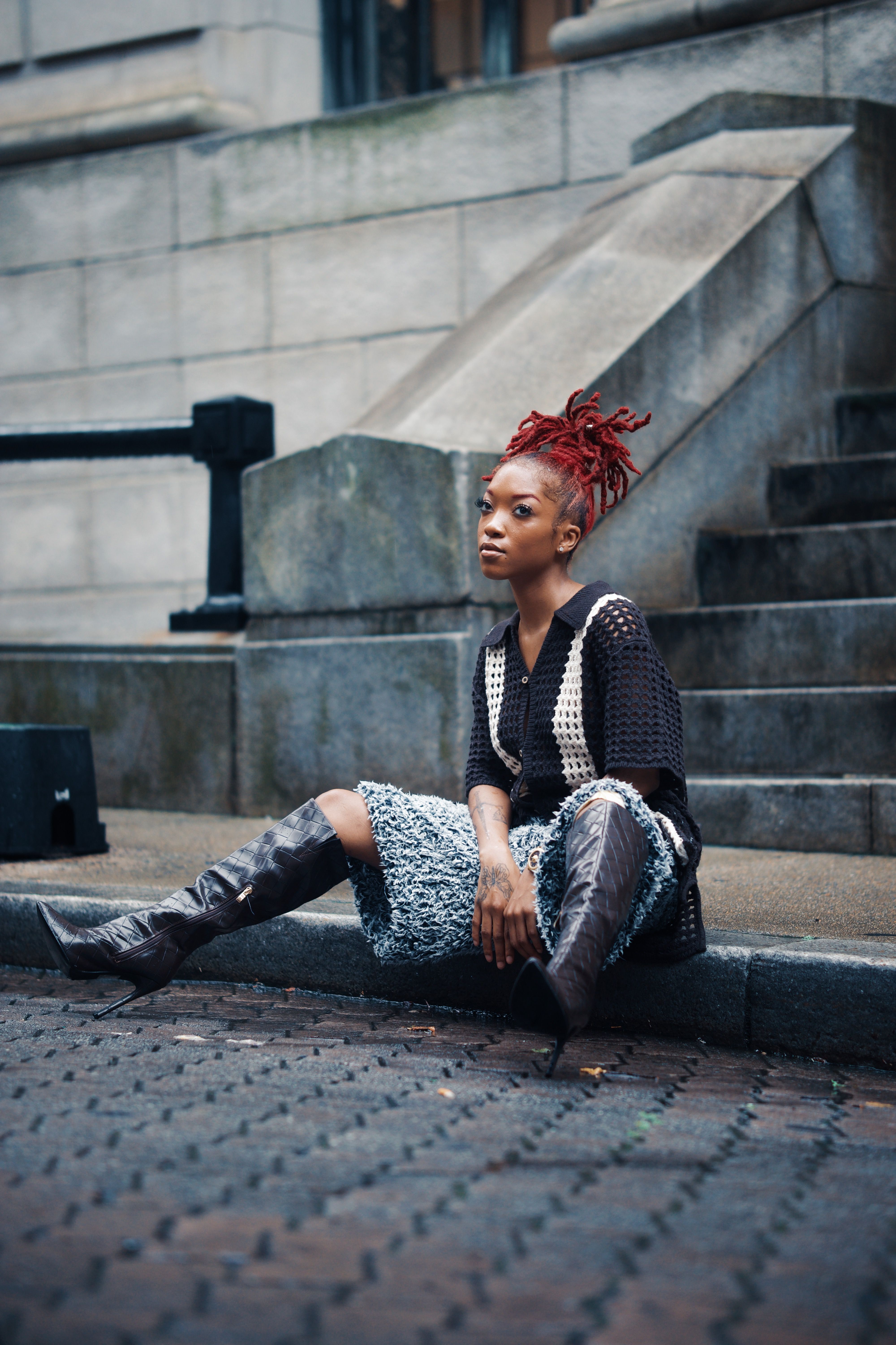 A Woman in Leather Jacket Standing on Steps · Free Stock Photo