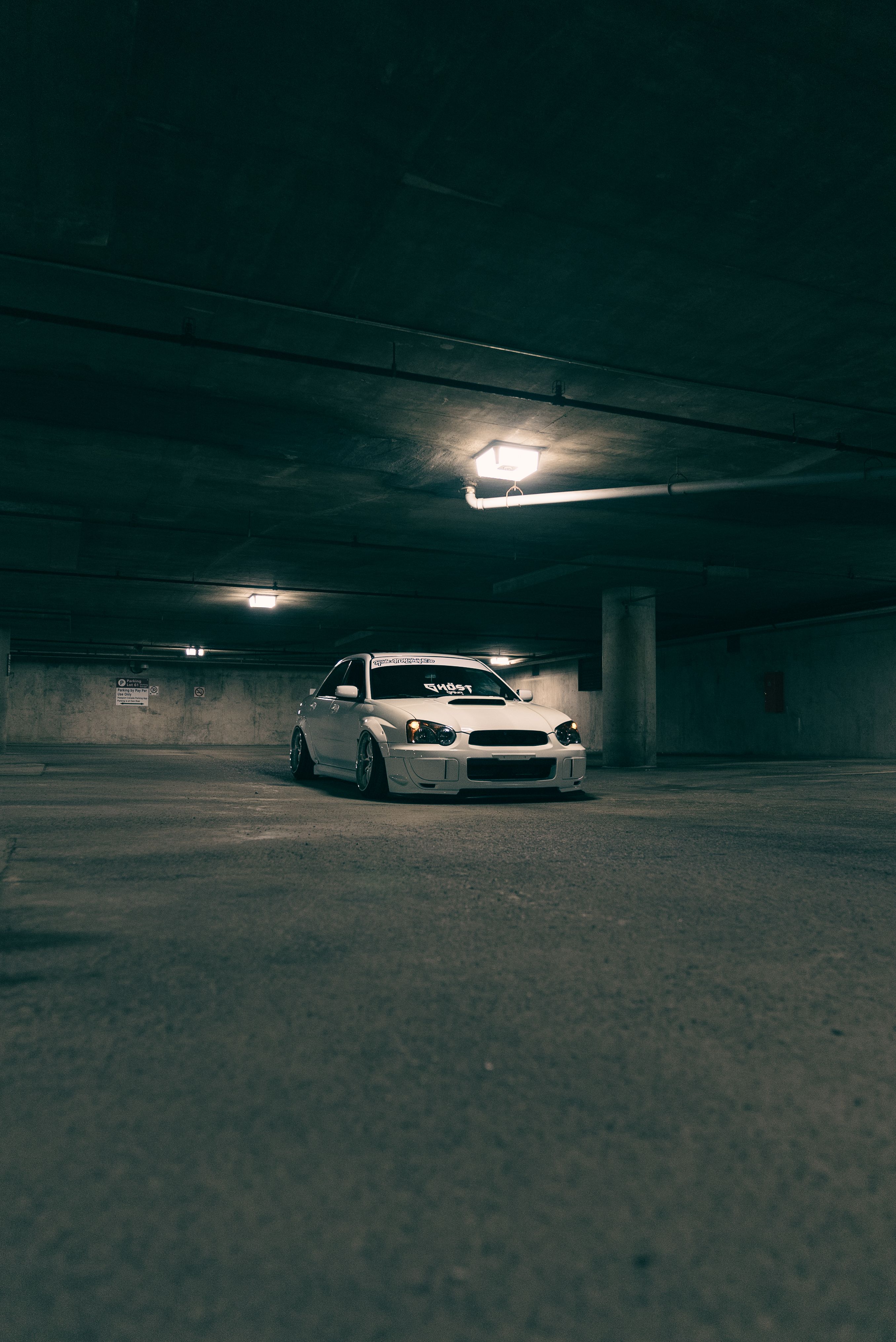 Moody Underground Parking Garage Scene at Night · Free Stock Photo