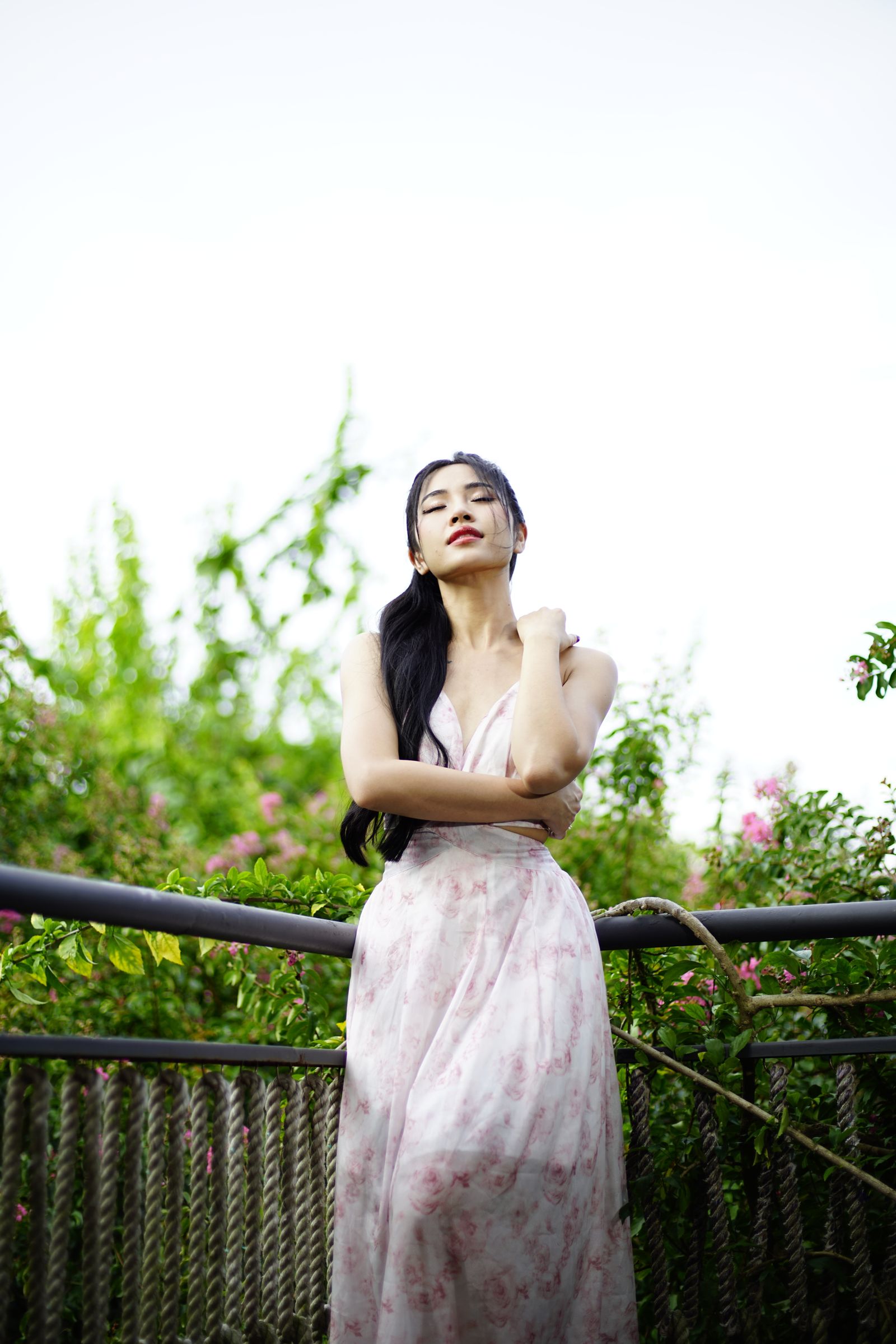 Woman In Pink Dress Holding Pink Flower · Free Stock Photo