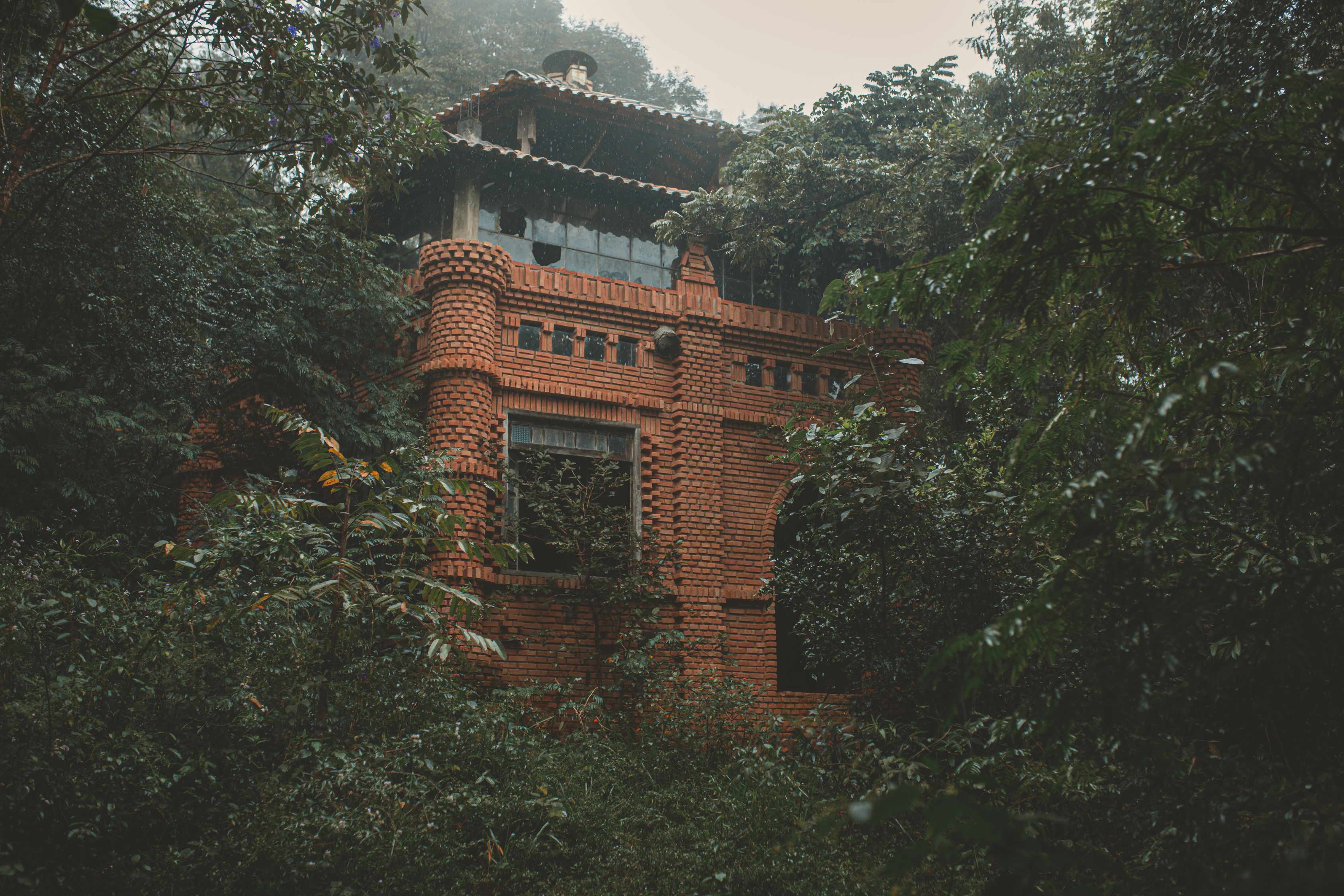 Forest Surrounded Building Photo Of Brick Building Surrounded By Trees · Free Stock Photo