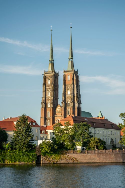 Free Beautiful view of Gothic cathedral towers in Wrocław, Poland by the river. Stock Photo