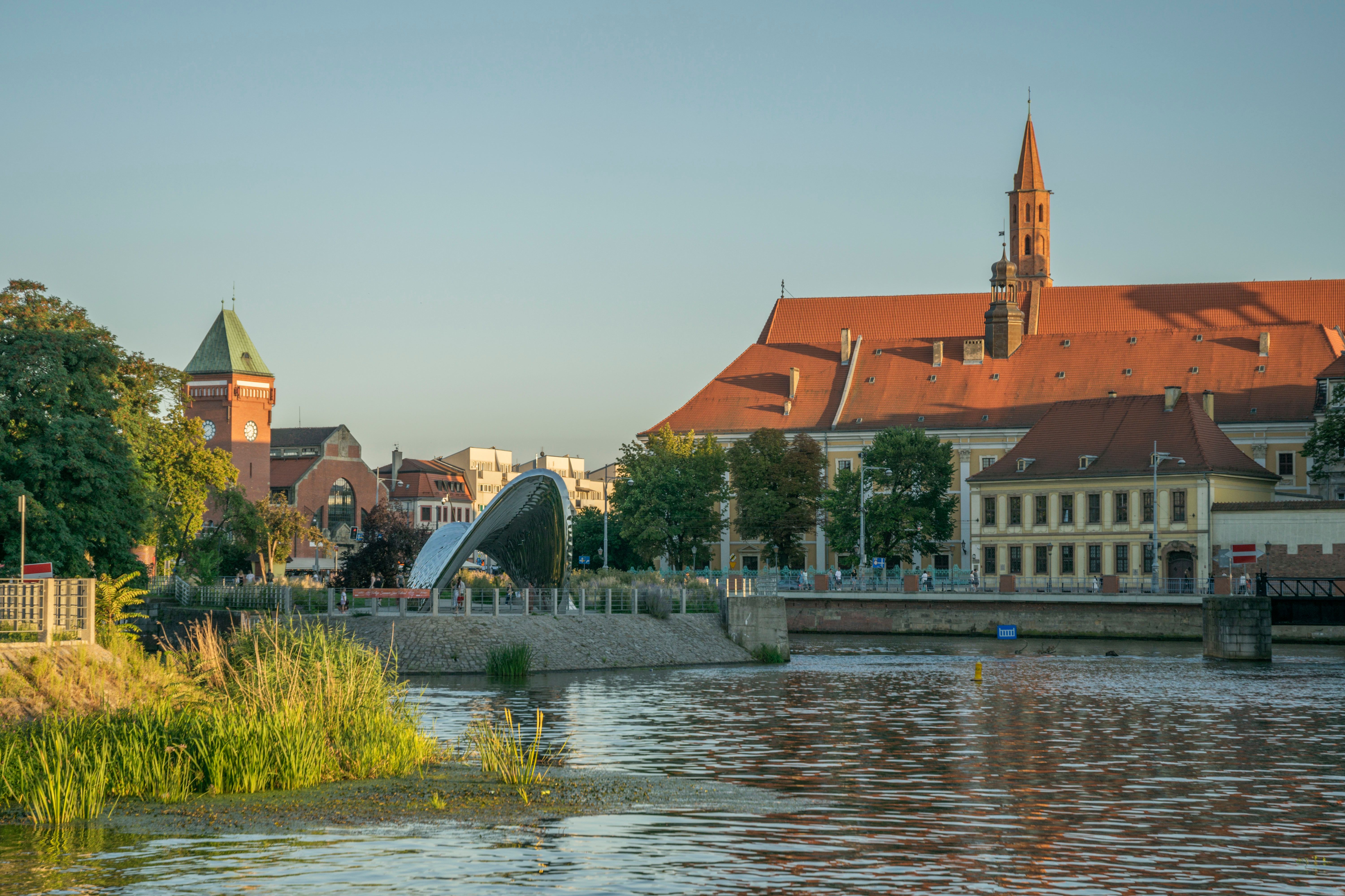 Explore Wrocław’s historic architecture and river scenery at sunset.