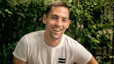 Man Wearing a White T-shirt Smiling