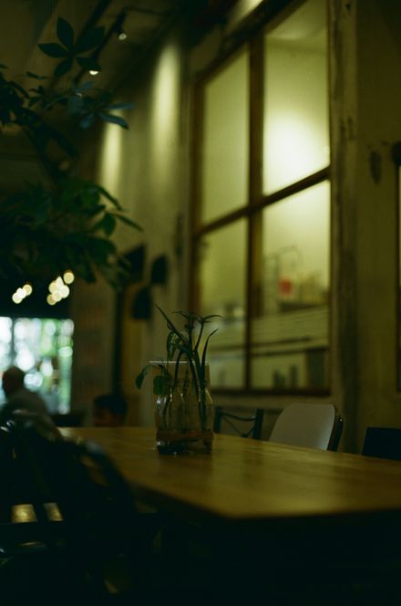 Warm cafe interior at dusk — photo by Din Aziz on Pexels