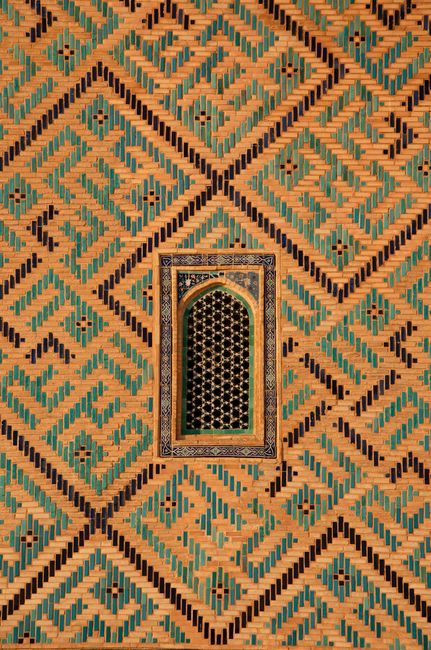 Historic architectural mosaic pattern on a building wall in Turkestan, Kazakhstan.