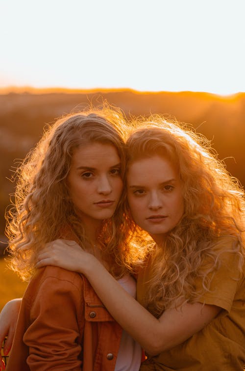 Two Women With Curly Hair