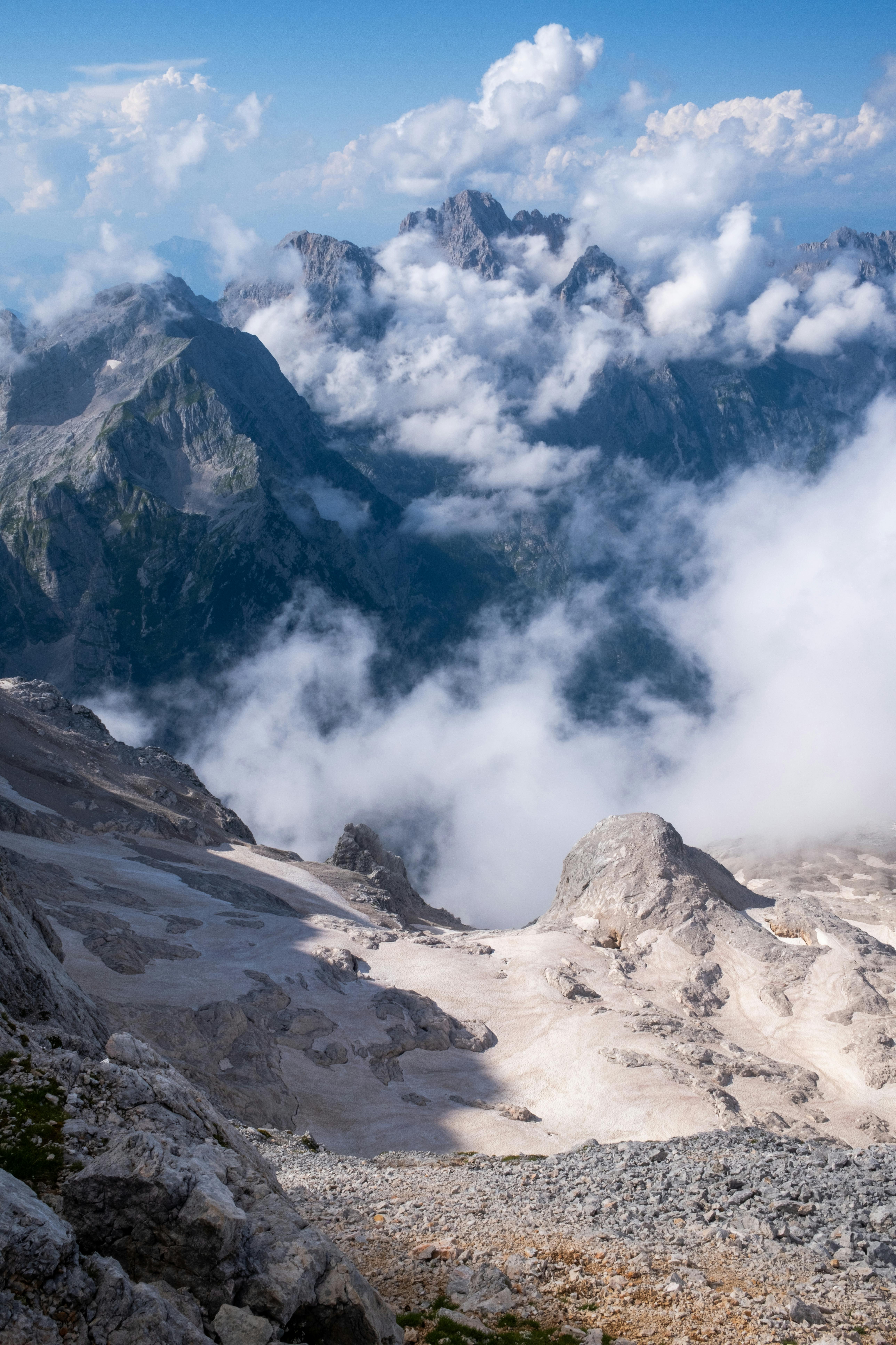 a view of the mountains and clouds from above