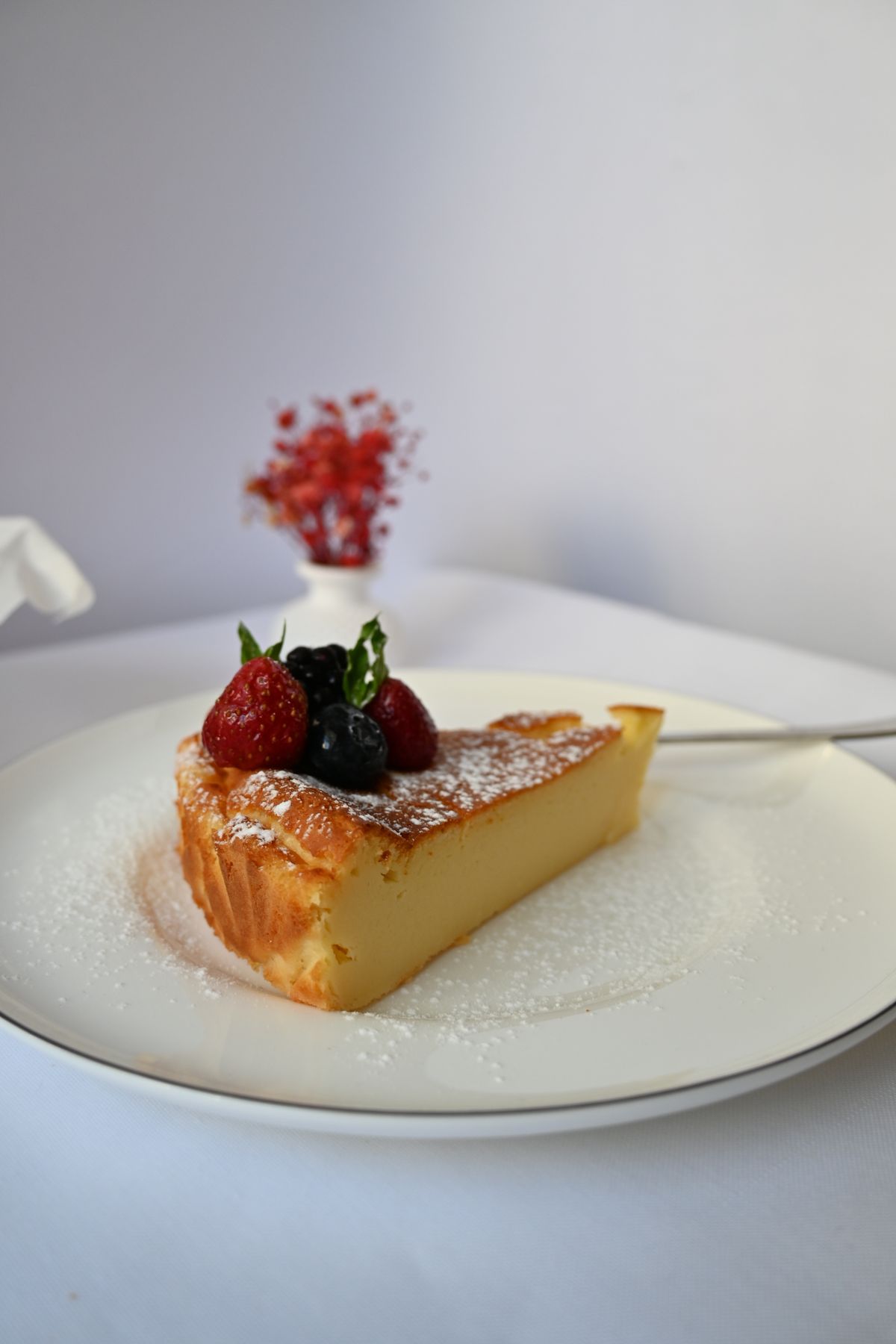Slice of creamy cheesecake with a crumb crust