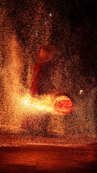 Captivating night fire performance in Guangzhou, showcasing traditional artistry and vibrant sparks.