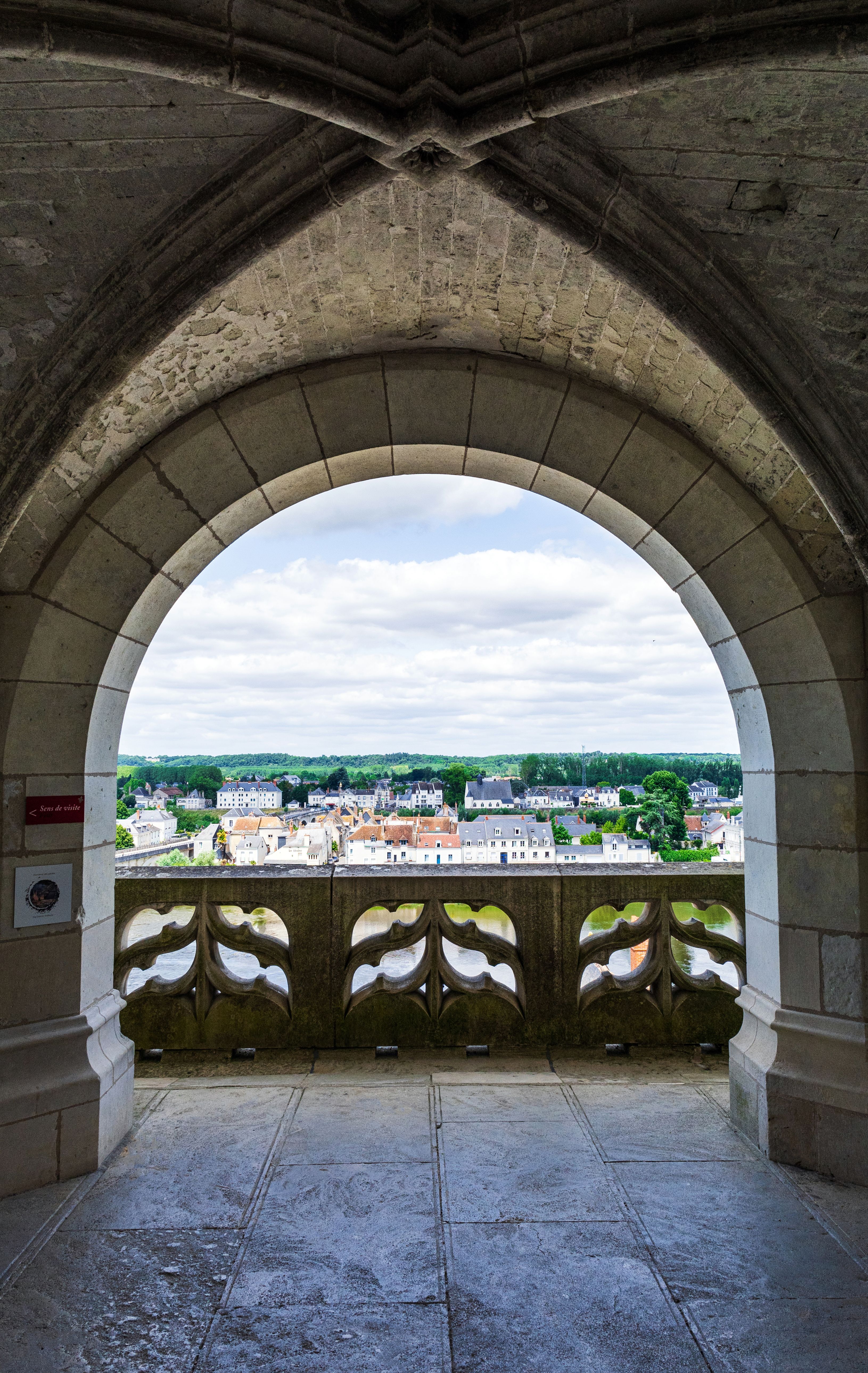 Charming landscape as seen through a Gothic archway in Amboise, France.