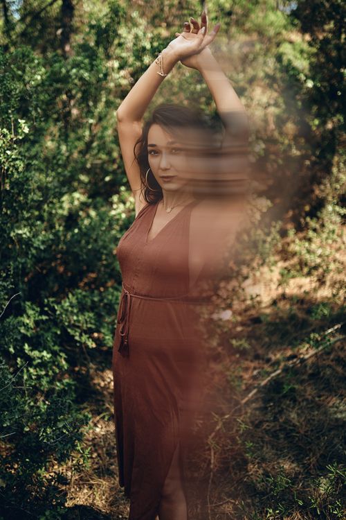 Free A creative portrait of a woman in a summer forest with artistic double exposure effect. Stock Photo