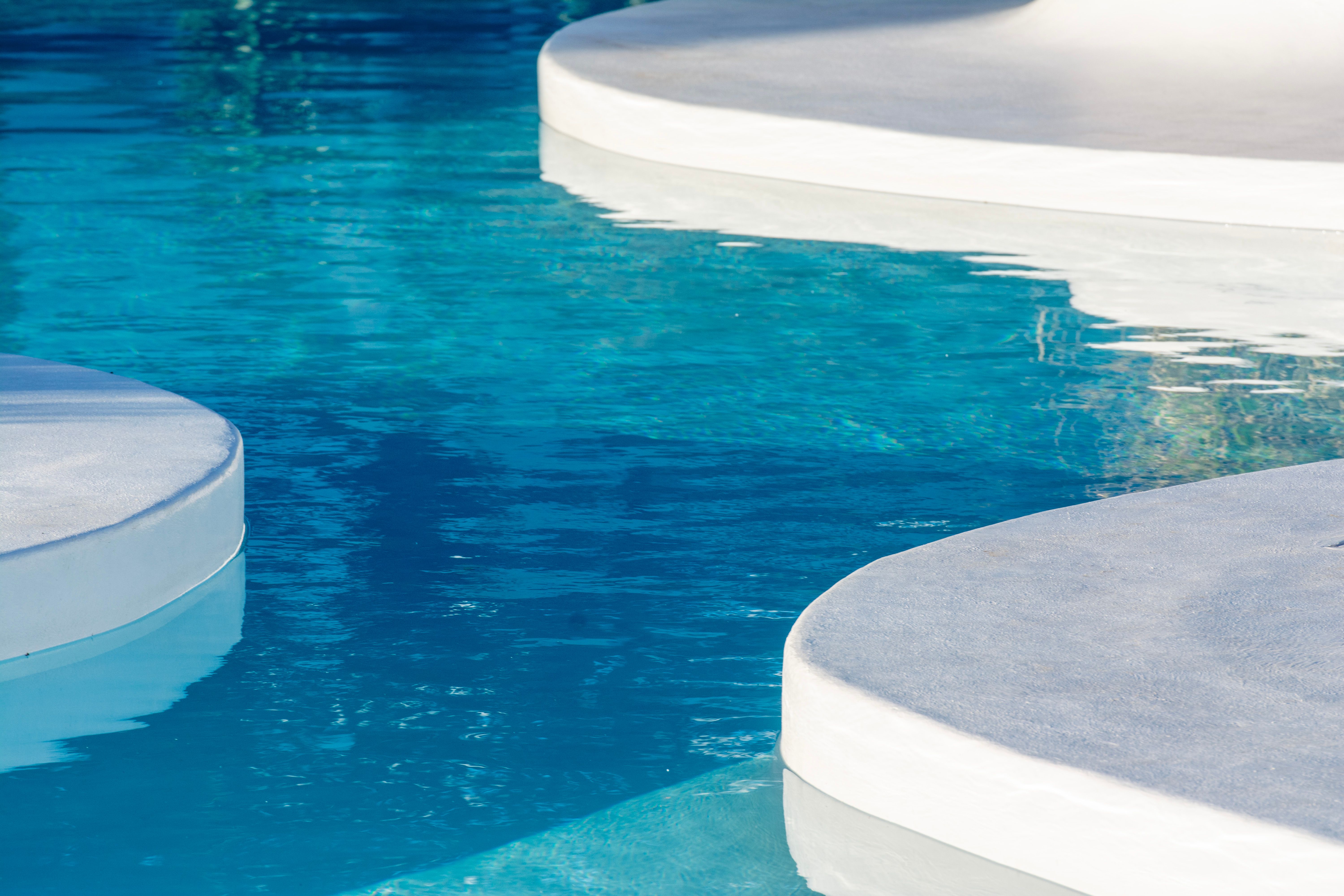 A high-end private travel lounge with minimalist design and expansive views of a serene landscape.